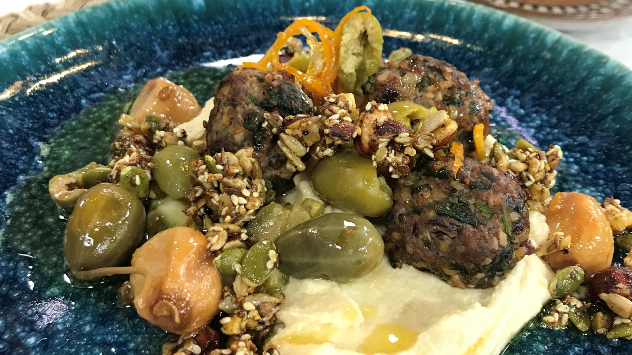 Lamb meatballs with spiced seeds and olive salad