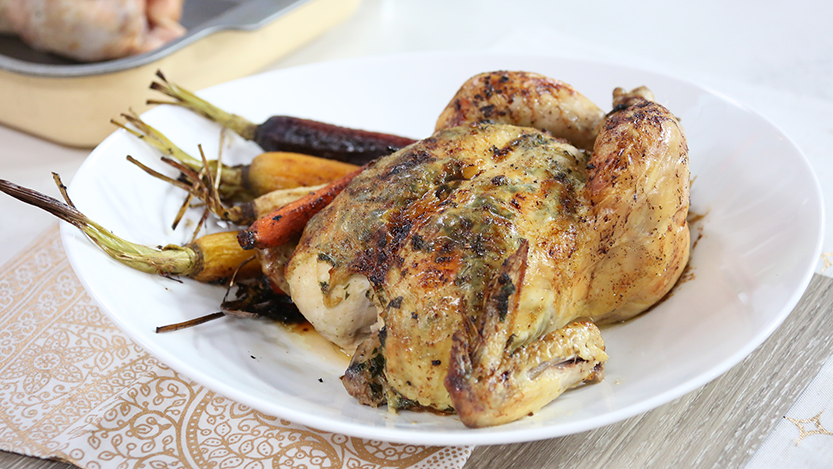 Whole roasted chicken with spiced butter and pomegranate roasted heirloom carrots