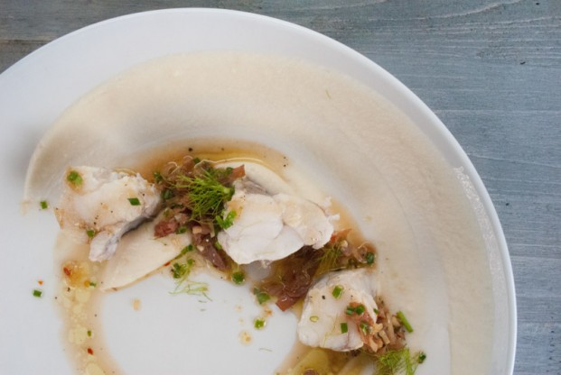 Champagne poached monkfish with prosciutto vinaigrette and garlic cauliflower purée