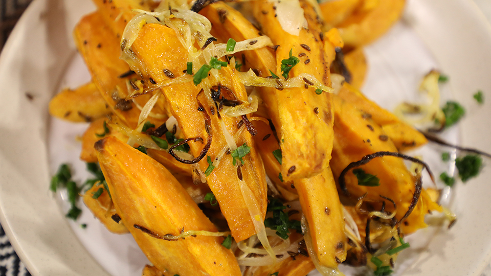 Roasted sweet potatoes with onion, dill and caraway seeds